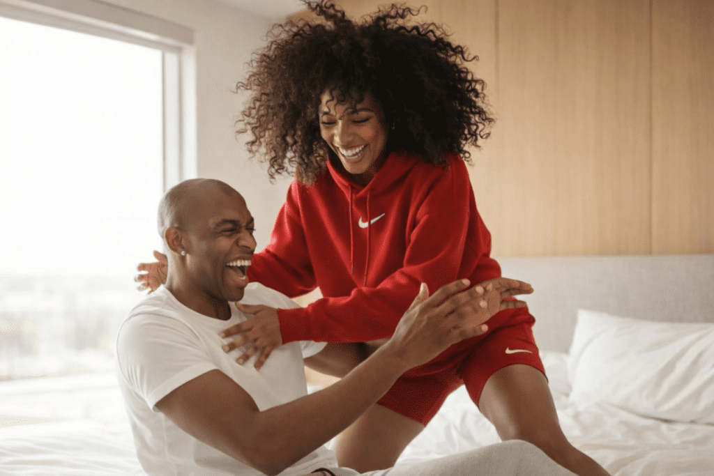 Peter and Sola laughing together while visiting Tunde in his newly acquired home, symbolising friendship and new beginnings