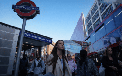 “Commuters outside Victoria Underground Station in London, representing UK workers facing high rental costs.”