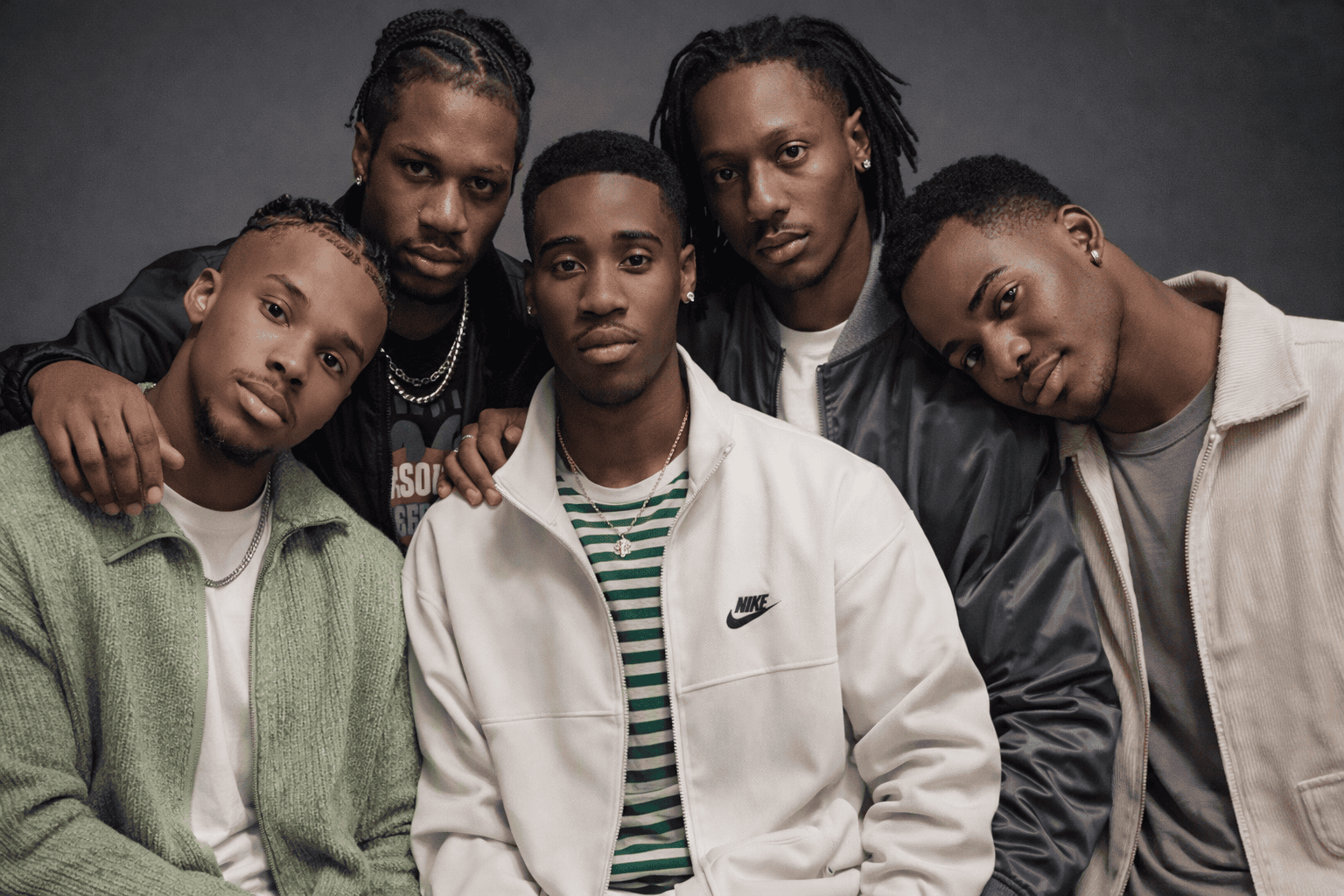 Five modern African men in stylish attire posing together for TCMP’s Fatherhood Mandate series