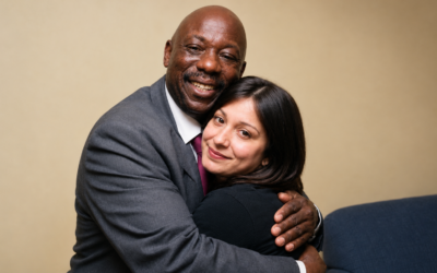 Joe Campbell warmly embraces April Paul, the woman he rescued as a newborn in 1994.